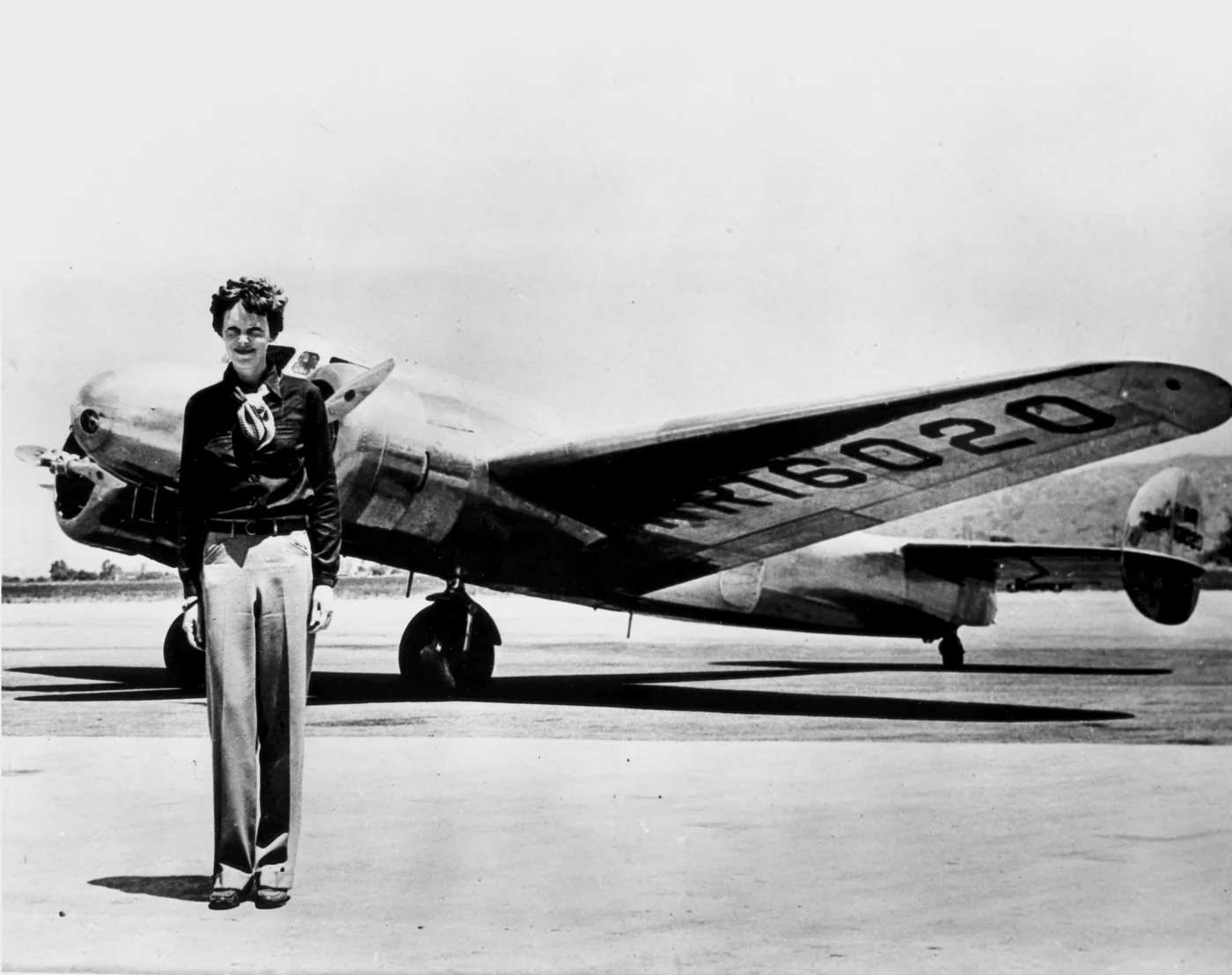 Amelia Earhart standing in front of her Lockheed Model 10 Electra, 1937