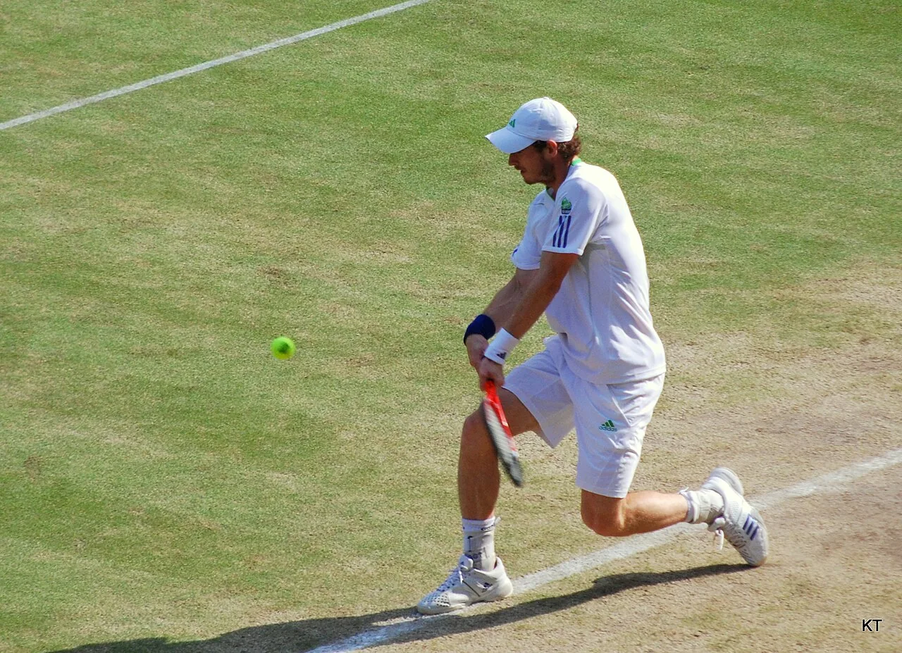 Andy Murray hitting a backhand at Wimbledon in 2011