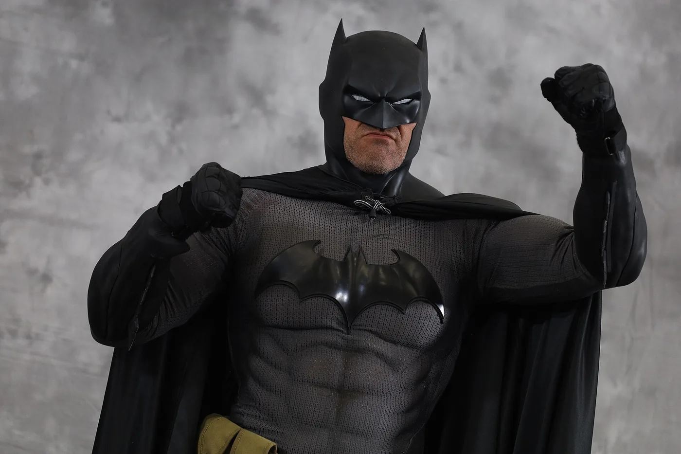 Batman in costume, cape held wide — one character, sixteen very different rankings