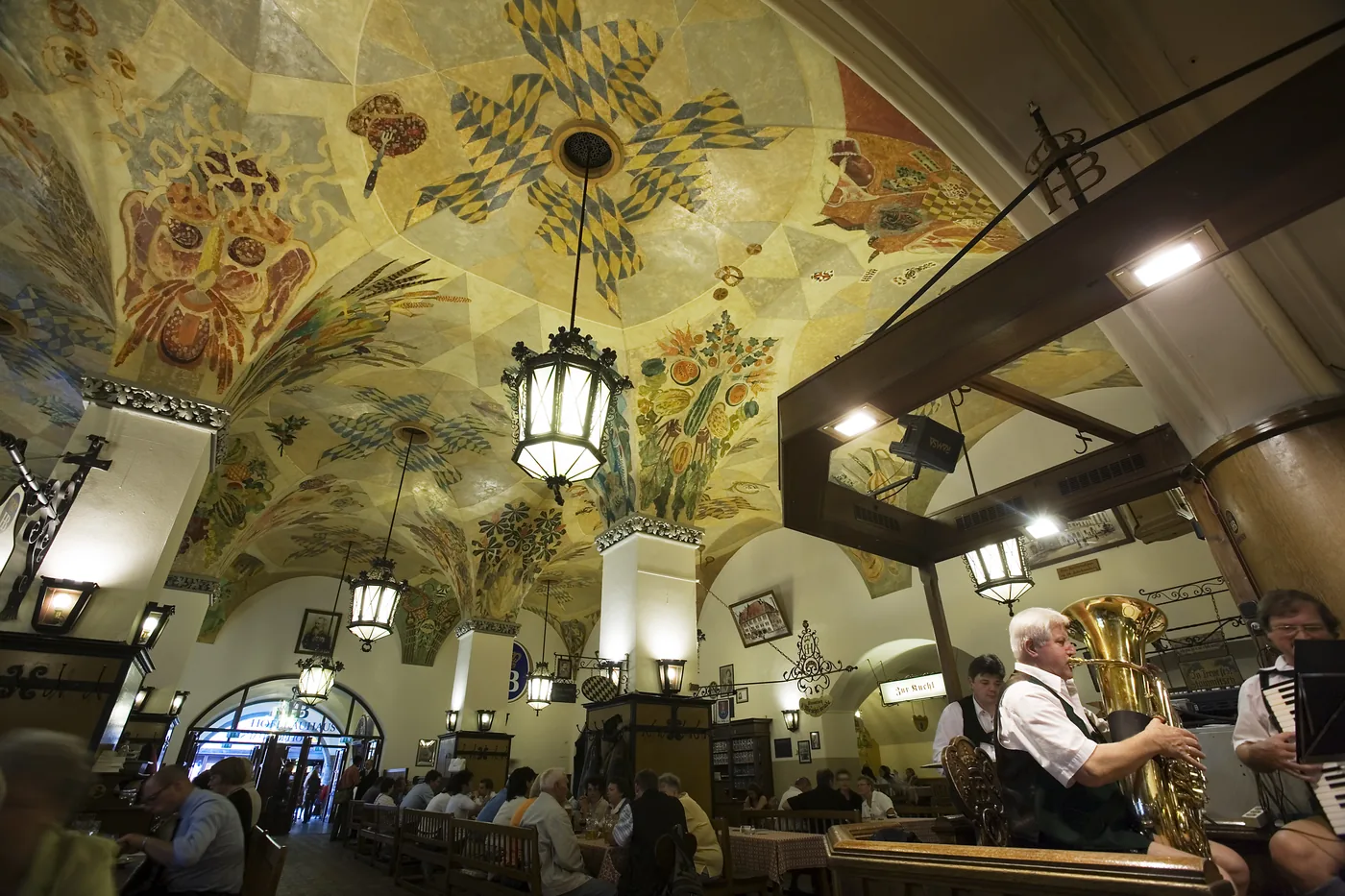 A Bavarian band playing under the painted ceiling of the Hofbräuhaus beer hall in Munich