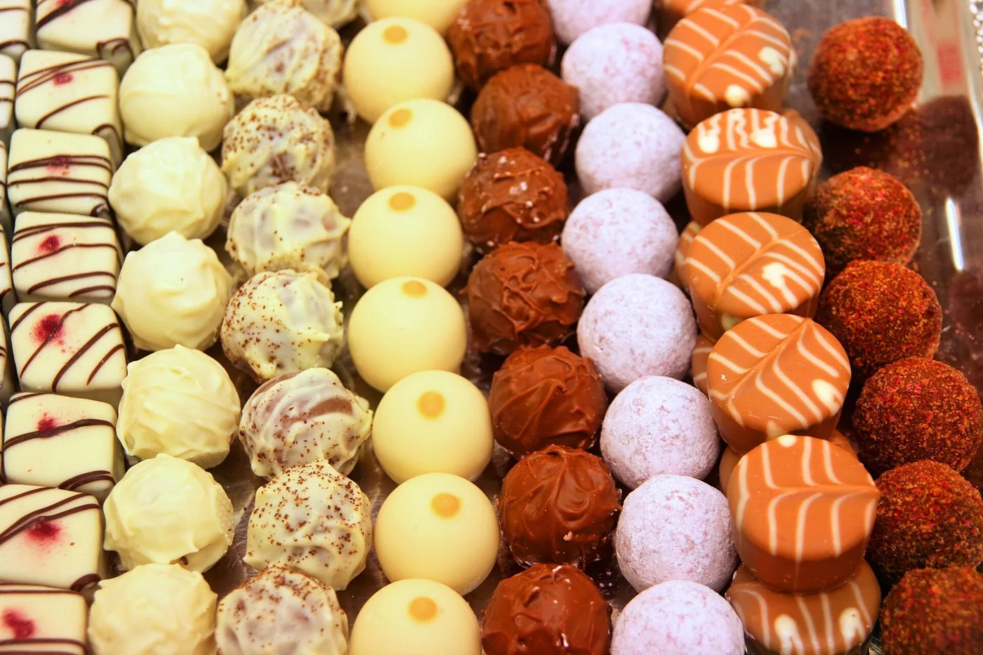 Rows of assorted chocolate pralines in a Vienna confectionery, the many forms of one ingredient