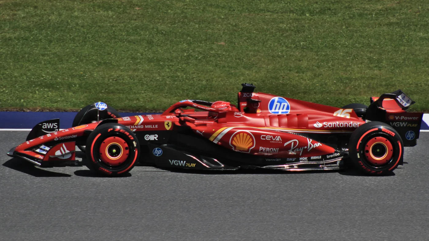 A Ferrari Formula 1 car on track, one of the many things the Ferrari name means