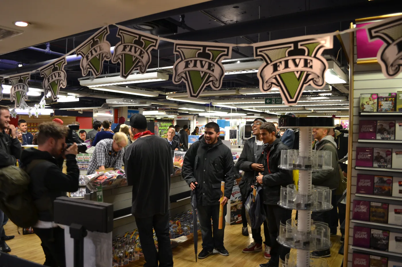 Shoppers under Grand Theft Auto V bunting at a London midnight launch