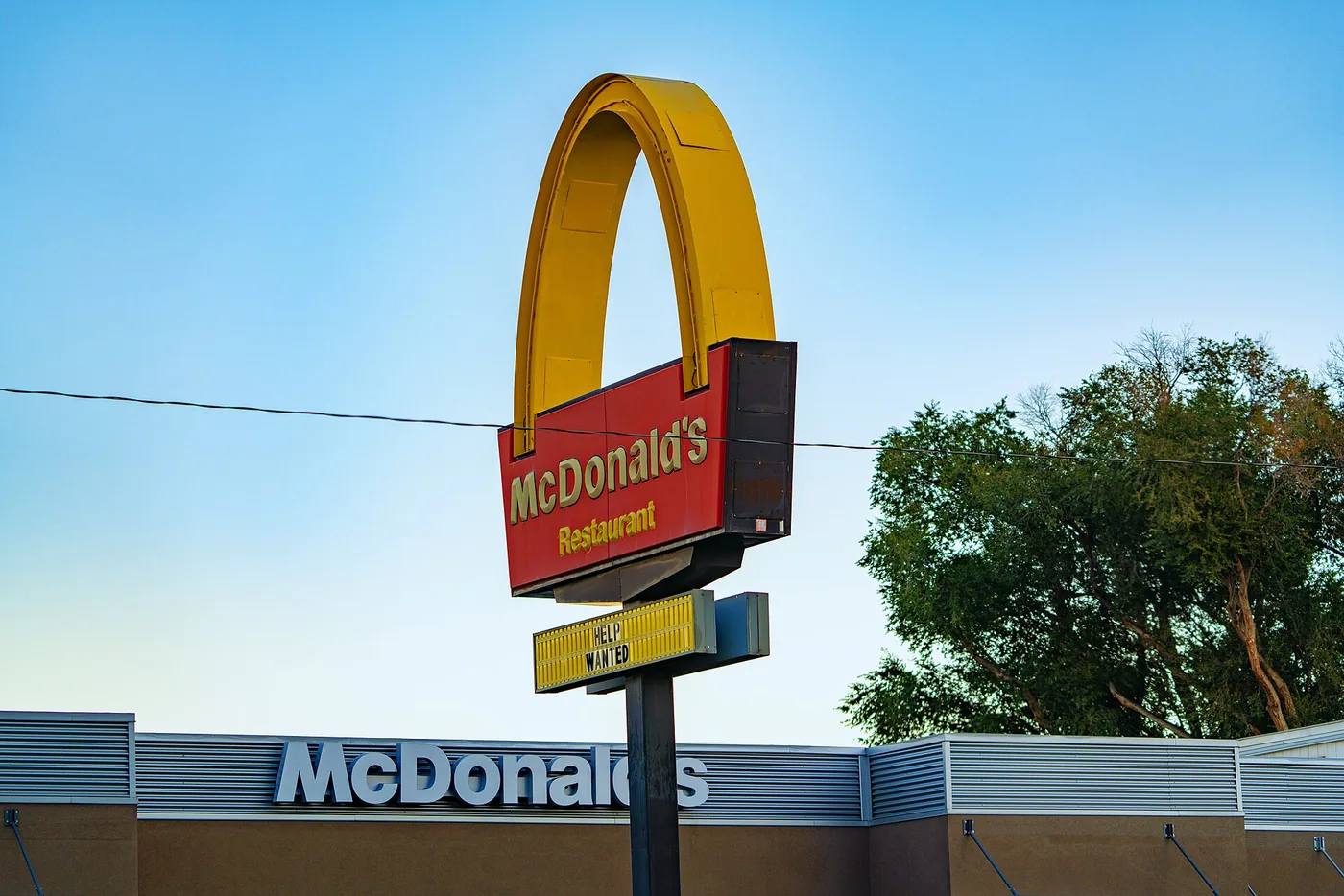 A single golden arch on a McDonald's sign in Montrose, Colorado
