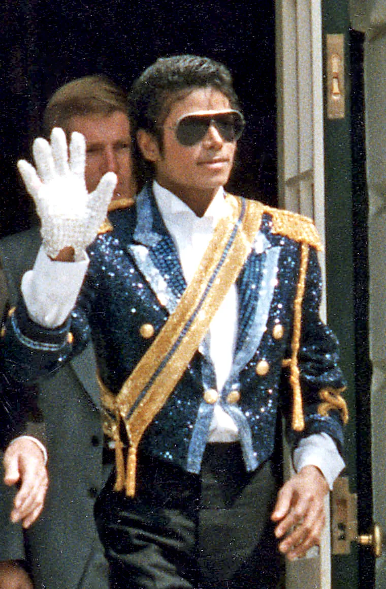 Michael Jackson in 1984, wearing the sequinned jacket and aviator sunglasses, photographed at the White House