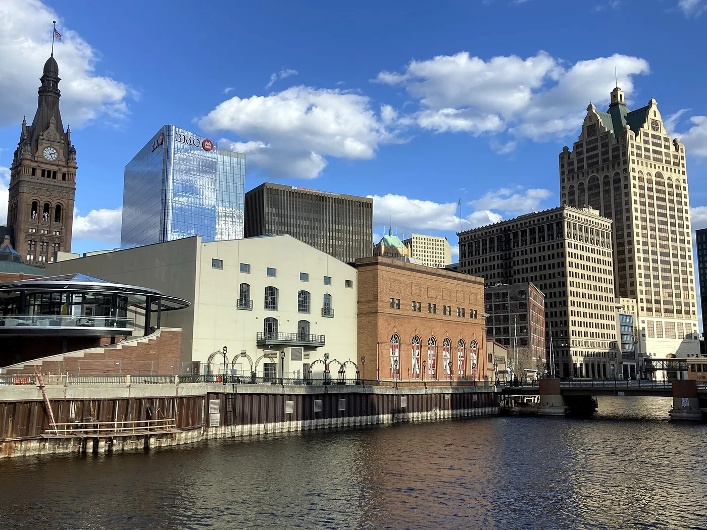 Downtown Milwaukee along the Milwaukee River, with City Hall's clock tower at left