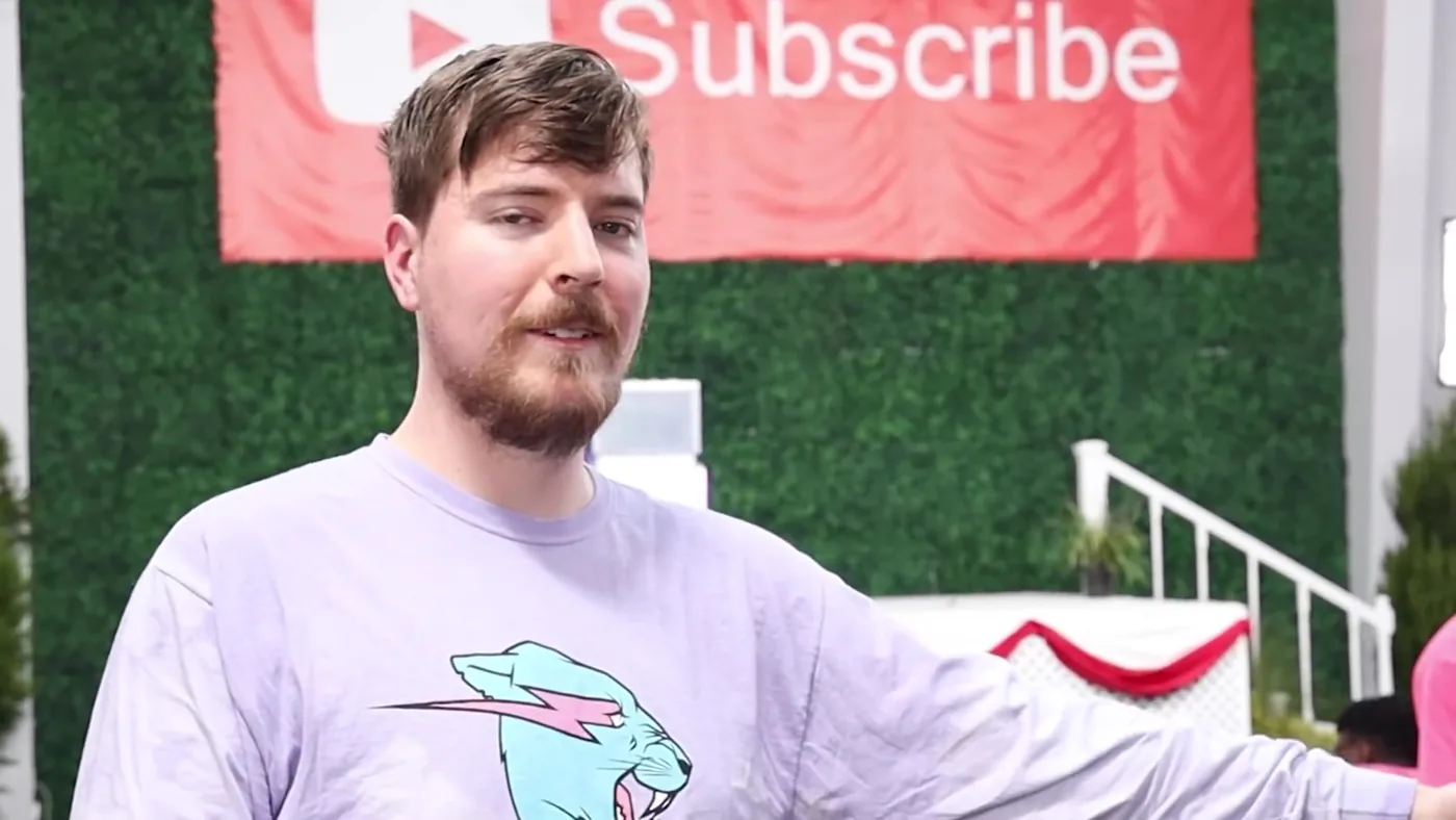 MrBeast, Jimmy Donaldson, in front of a YouTube Subscribe banner in 2022