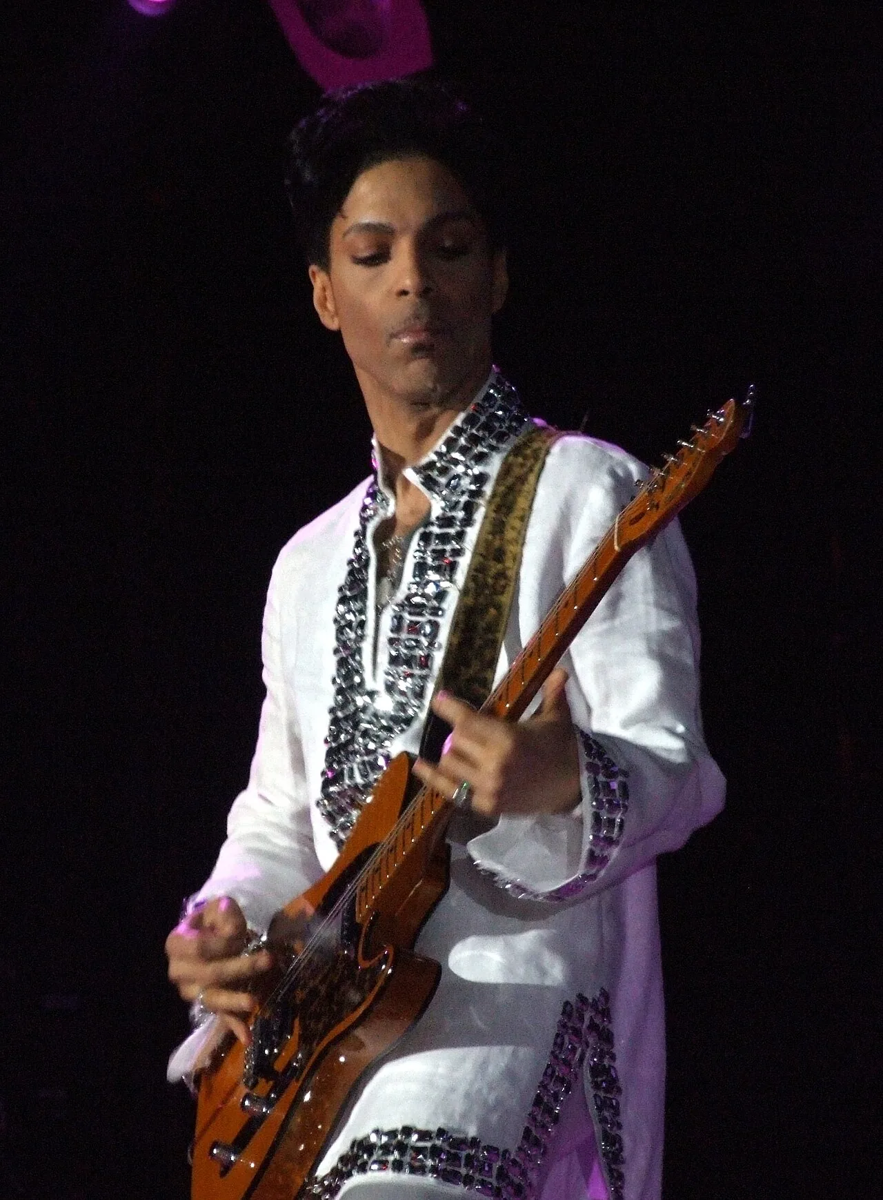 Prince playing guitar on stage at Coachella in April 2008