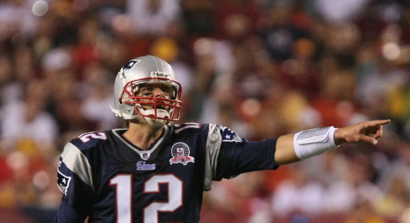 Tom Brady in New England Patriots #12, calling out a protection change