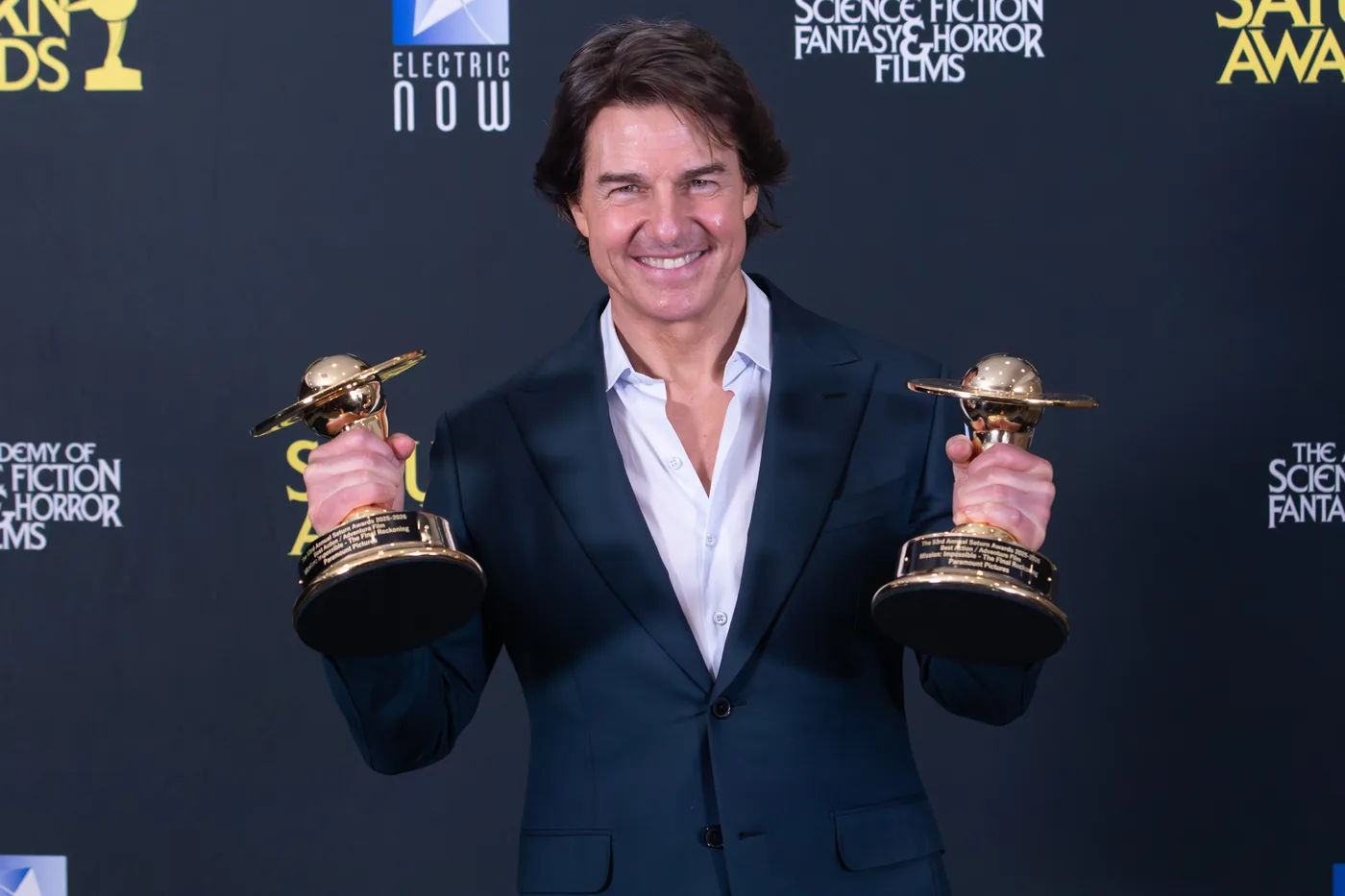 Tom Cruise holding two Saturn Awards at the 53rd Saturn Awards in Los Angeles, March 2026